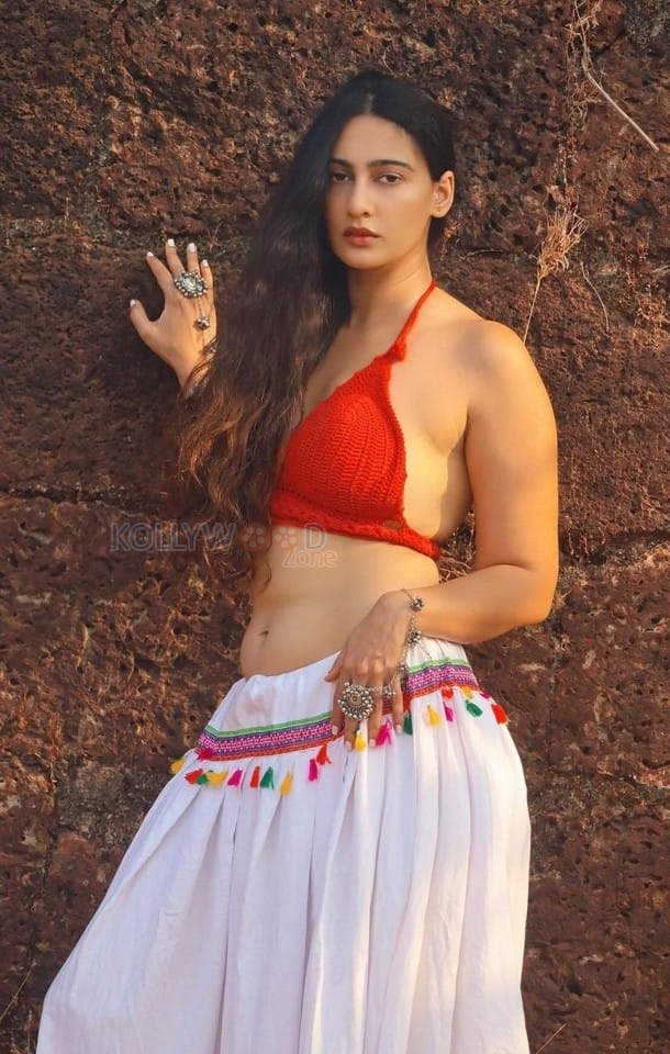 Kathal A Jackfruit Mystery Actress Megha Shukla in a Red Bralette Blouse and White Skirt Pictures 01