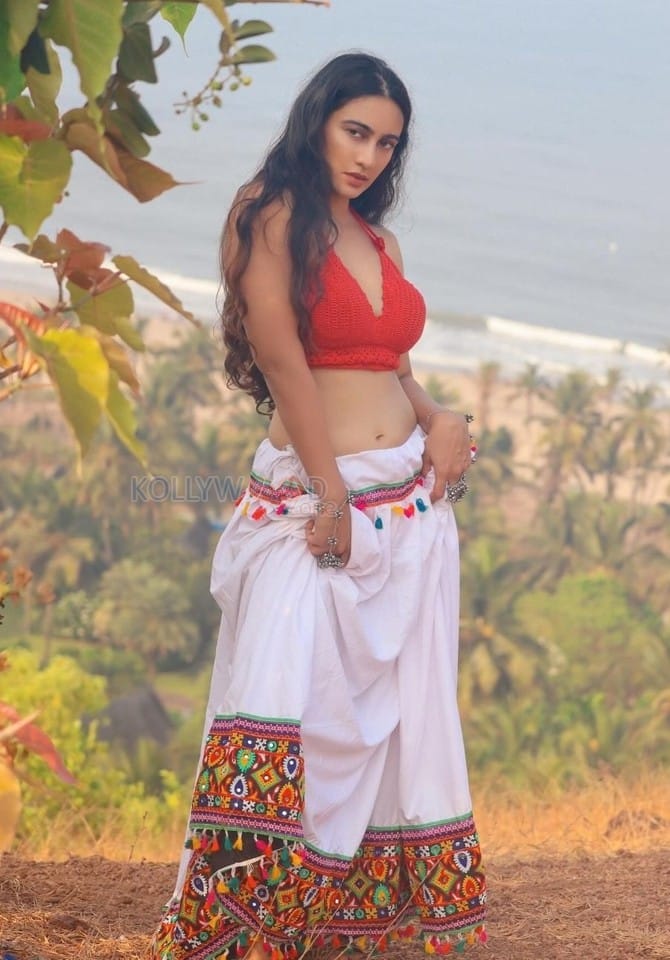 Kathal A Jackfruit Mystery Actress Megha Shukla in a Red Bralette Blouse and White Skirt Pictures 03