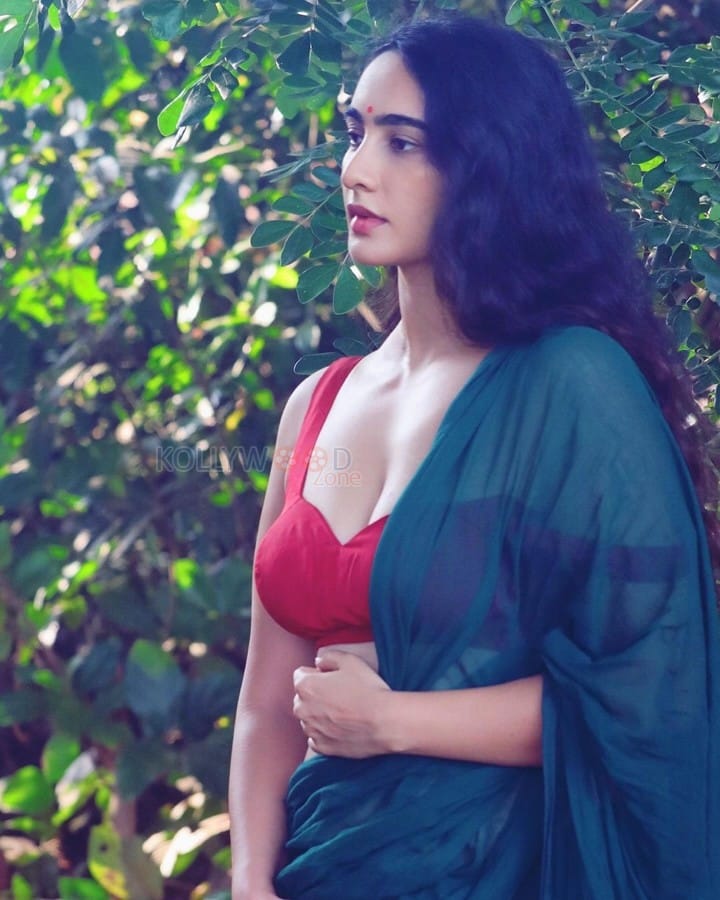 Stunning Megha Shukla in a Green Saree with a Sleeveless Red Blouse Photos 01