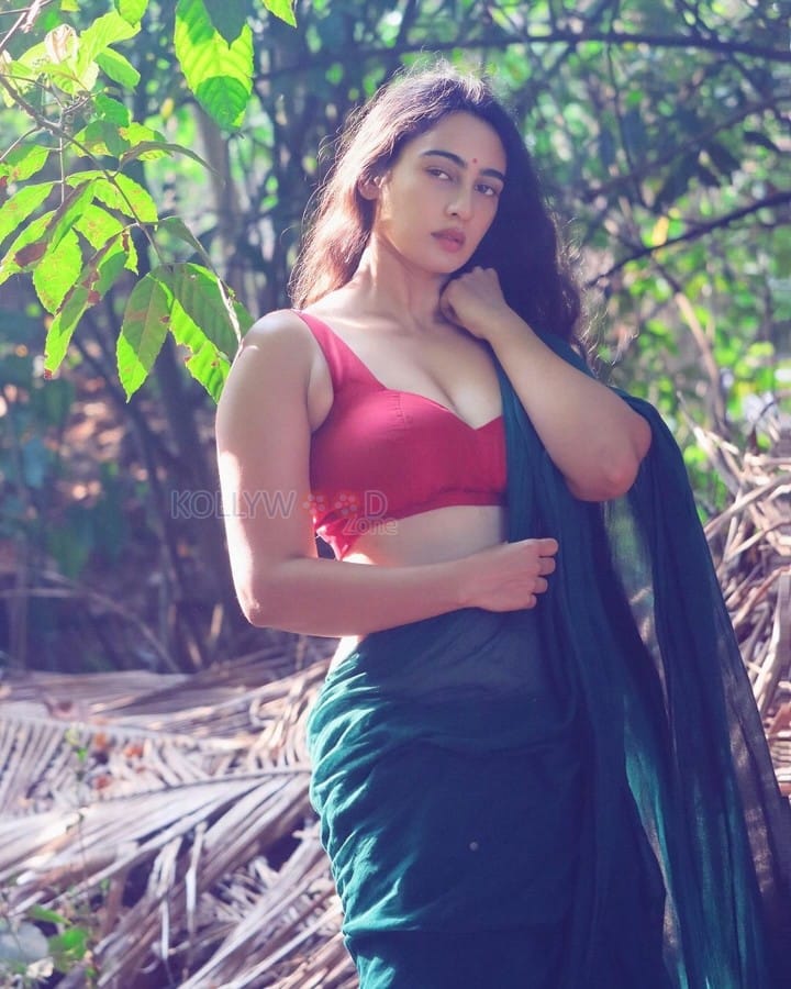 Stunning Megha Shukla in a Green Saree with a Sleeveless Red Blouse Photos 03