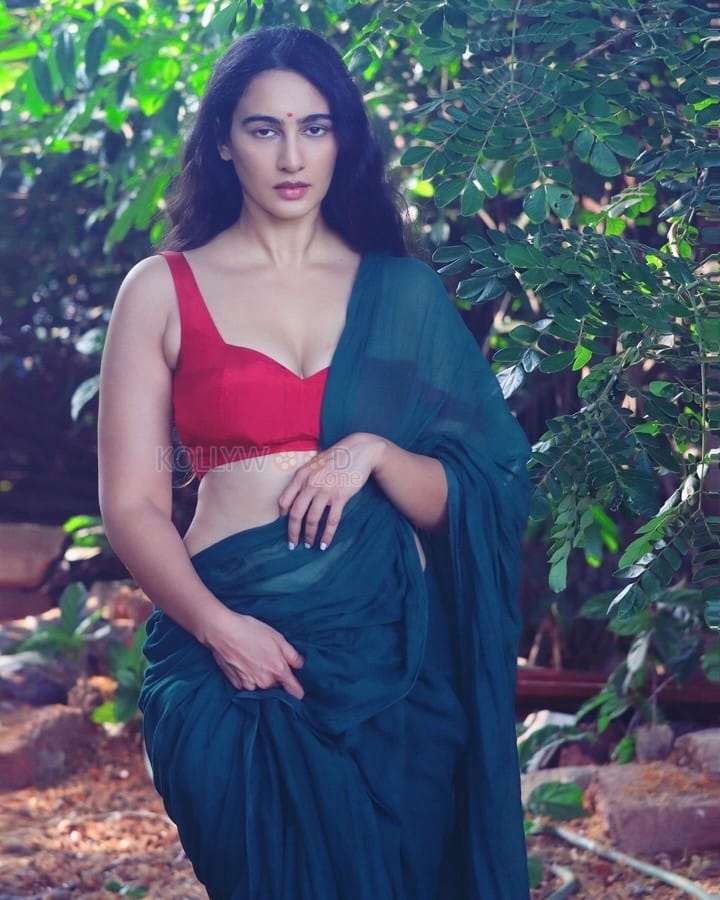 Stunning Megha Shukla in a Green Saree with a Sleeveless Red Blouse Photos 05