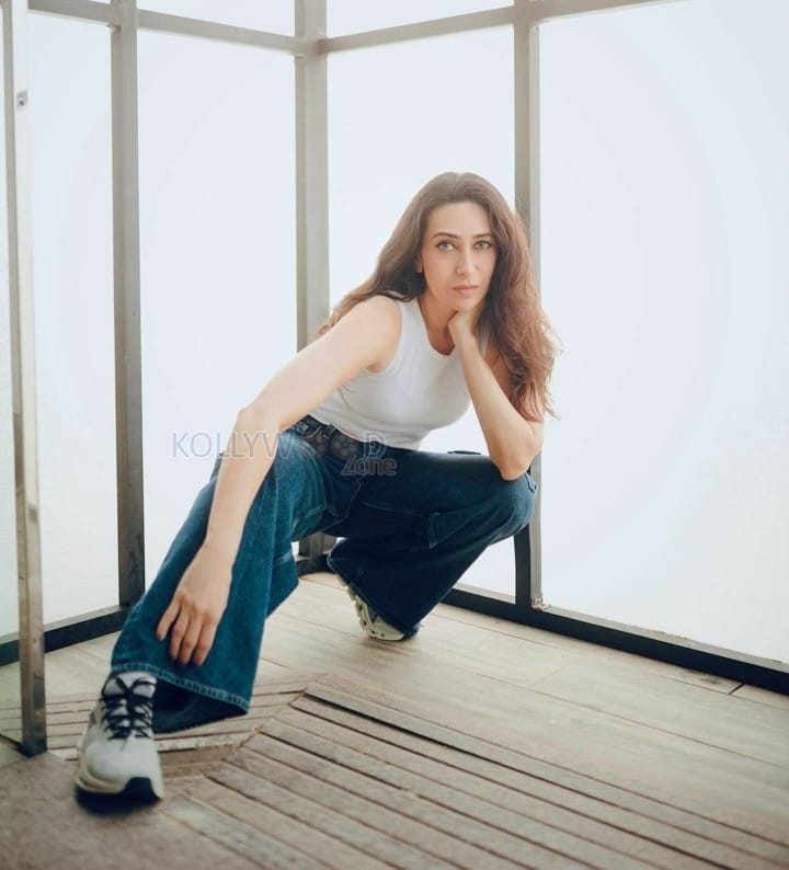 Actress Karisma Kapoor in a Classic Jeans and White Top Photos 03