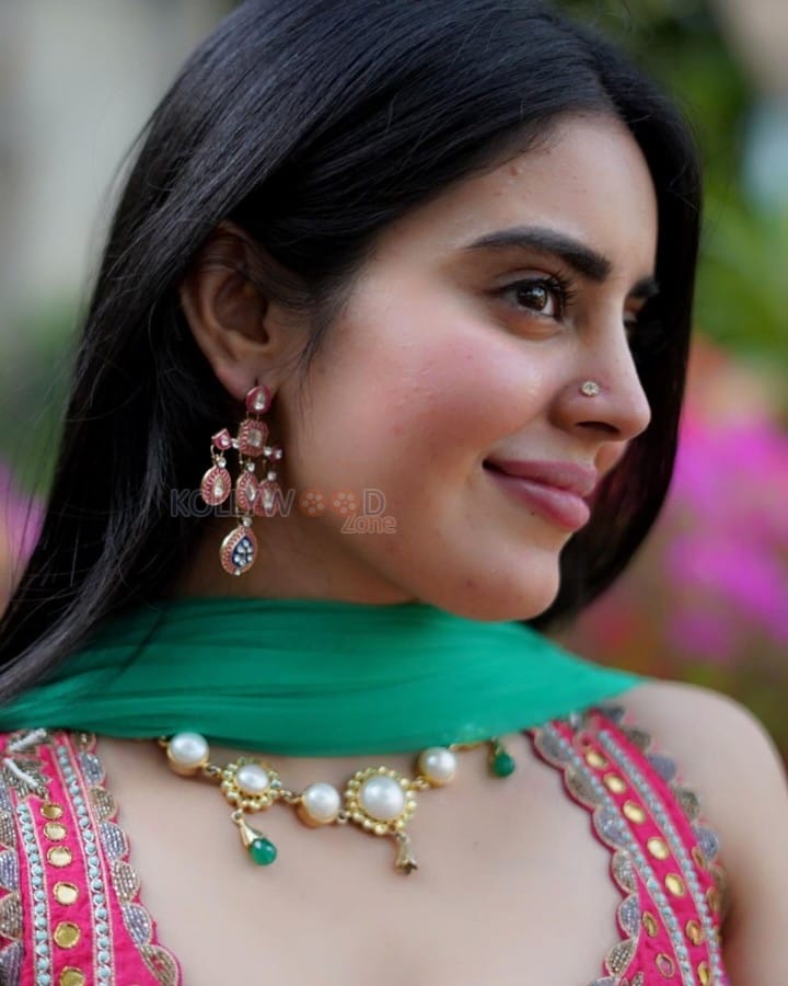 Actress Kushita Kappullu in a Green Printed Lehenga with a Red Blouse Photos 04