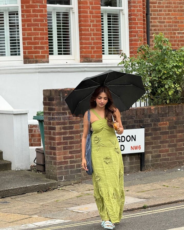 Beautiful Jiya Shankar in an Olive Midi Dress outside The Market Coffee House and Bar in London Photos 03