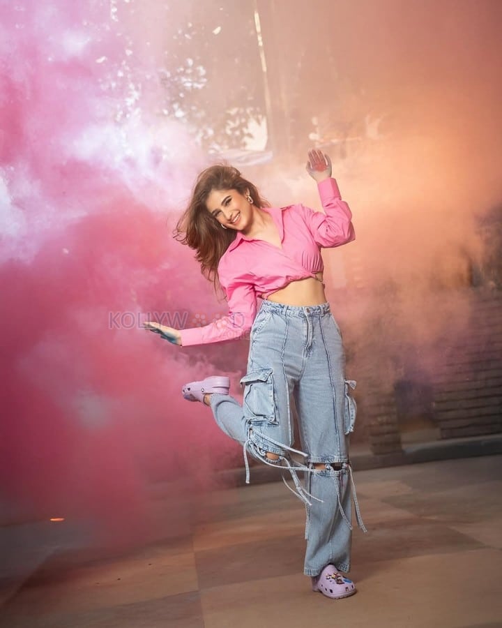 Sexy Rasha Thadani in a Pink Knot Shirt and Torn Denim Pants for Holi Celebration Photos 02