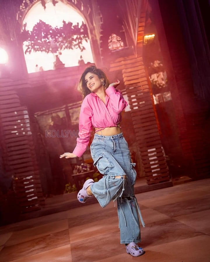 Sexy Rasha Thadani in a Pink Knot Shirt and Torn Denim Pants for Holi Celebration Photos 03