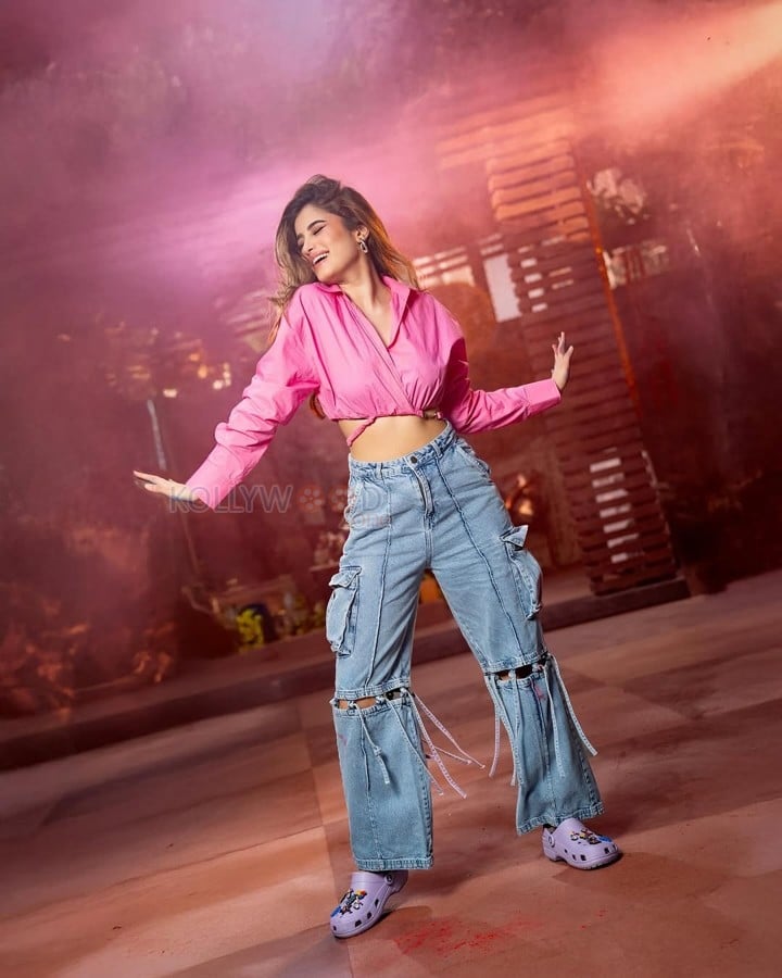 Sexy Rasha Thadani in a Pink Knot Shirt and Torn Denim Pants for Holi Celebration Photos 07