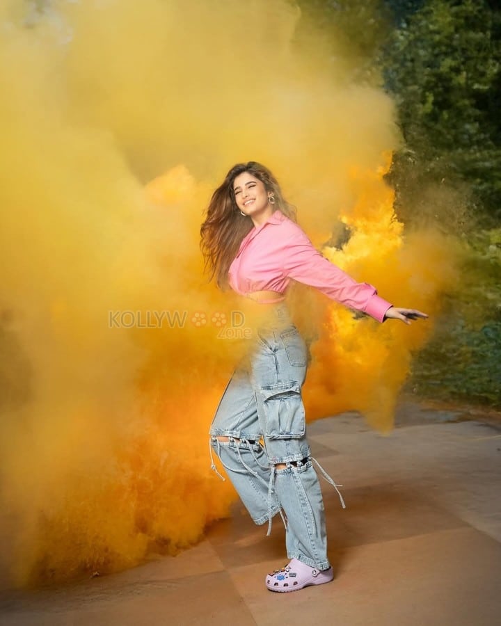 Sexy Rasha Thadani in a Pink Knot Shirt and Torn Denim Pants for Holi Celebration Photos 08