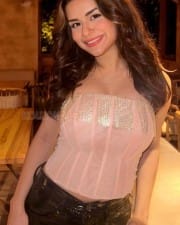 Trendy Avneet Kaur in a Low Neck Corset Crop Top and Shiny Jeans Photos 01