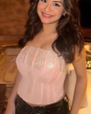 Trendy Avneet Kaur in a Low Neck Corset Crop Top and Shiny Jeans Photos 02