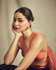 Actress Ananya Panday in a Coral Silk Chiffon Choli Top and Black Crepe Crossover Pants Photos 03