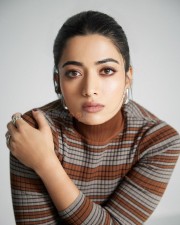 Adorable Actress Rashmika Mandanna in an Oversized Black Puff Jacket with Chic Top and Skirt with Black Leggings Photos 07