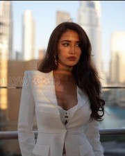 Baaghi 2 Actress Disha Patani Cleavage in a White Chic Blazer Top and Skirt Photos 01