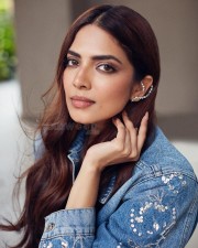 Beautiful Actress Malavika Mohanan in a Black Crop Top with a Matching Shorts and Denim Shirt Photos 04