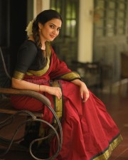 Beautiful Aditi Ravi in a Maroon Silk Saree with Contrast Black Peacock Zari Border Photos 01
