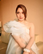 Breathtaking Tamannaah Bhatia in a Ruffled One Shoulder White Top with Ripped Denim Jeans Photos 05