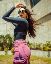 Casual Chick Nora Fatehi in a Black Turtleneck Top and Pink Jeans Photos 01