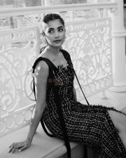 Dazzling Pooja Hegde in a Black Sleeveless Tweed Dress Pictures 05