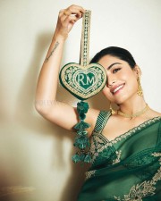 Elegant Rashmika Mandanna in an Emerald Green Saree with Sleeveless Blouse and Heart Shaped Bag Photos 03