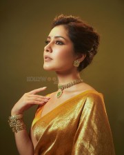 Golden Beauty Raashi Khanna in a Yellow Silk Saree with Sleeveless Blouse Pictures 05