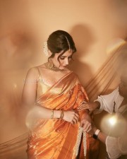 Gorgeous Raashi Khanna in a Golden Silk Orange Saree Photos 01