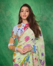 Graceful Nora Fatehi in a Floral Saree Pictures 01