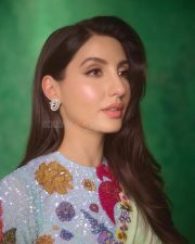 Graceful Nora Fatehi in a Floral Saree Pictures 02