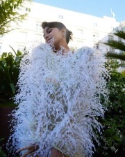 Jacqueline Fernandez in a White Mini Feathered Dress at Cannes Film Festival Photos 04