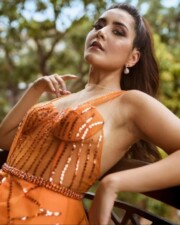 Jaw Dropping Raashi Khanna in an Orange Dress showing Sideboob Photo 01