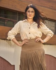 Parasakthi Heroine Regina Cassandra in a Linen Textured Shirt and Sueded Fringe Skirt Photos 02