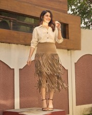 Parasakthi Heroine Regina Cassandra in a Linen Textured Shirt and Sueded Fringe Skirt Photos 06