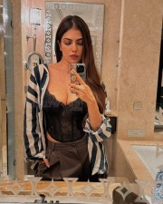 Sexy Malavika Mohanan Mirror Selfie in a Black Corset and Striped Shirt Photos 02