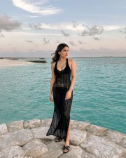Sexy Saniya Iyappan in a See Through Black Dress Holiday Photos 02