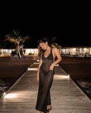 Sexy Saniya Iyappan in a See Through Black Dress Holiday Photos 03