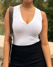 Sexy and Erotic Malavika Mohanan in a White Figure Hugging White Top and Black Pant Photos 02