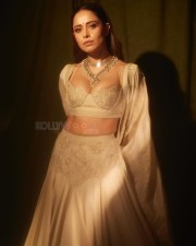 Sizzling Nushrratt Bharuccha in a Beige Lehenga with a Plunging Neckline Blouse Photos 03