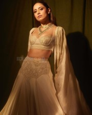 Sizzling Nushrratt Bharuccha in a Beige Lehenga with a Plunging Neckline Blouse Photos 05