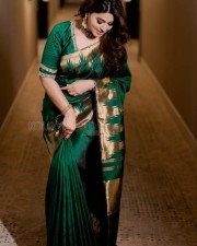 Smile Queen Sneha in a Green Silk Saree Photos 01