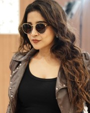 South Actress Sakshi Agarwal in a Black Crop Top and Black Jeans with a Matching Brown Leather Jacket Photos 01