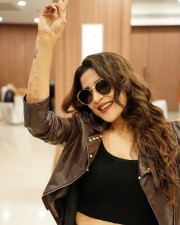 South Actress Sakshi Agarwal in a Black Crop Top and Black Jeans with a Matching Brown Leather Jacket Photos 02