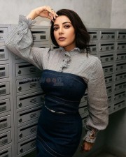 Stunning Actress Kajal Aggarwal in a Classy Dark Blue Denim Tube Top and Black Slit Skirt Photos 02
