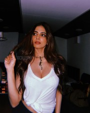 Stunning Malavika Mohanan in a See Through White Top with Lace Bra Photos04