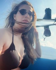 Stunning Raai Laxmi Cleavage in a Tiny Black Bikini Photos 04