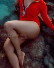 Stunning Rima Kallingal in a Red One Piece Swimsuit Pictures 01