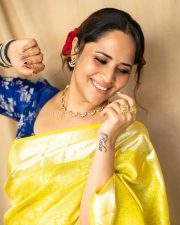 Anasuya Bharadwaj in a Bright Yellow Saree with a Royal Blue Blouse Pictures 01