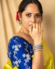 Anasuya Bharadwaj in a Bright Yellow Saree with a Royal Blue Blouse Pictures 02