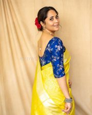 Anasuya Bharadwaj in a Bright Yellow Saree with a Royal Blue Blouse Pictures 04