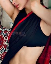 Erotic Mouni Roy Showing Navel in a Black Saree wtih Red Border Photos 01