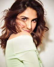 Gorgeous Vaani Kapoor in a Green Figure Hugging Off Shoulder Dress Pictures 01