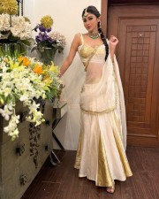 Stunning Mouni Roy in a White and Gold Lehenga Photos 04